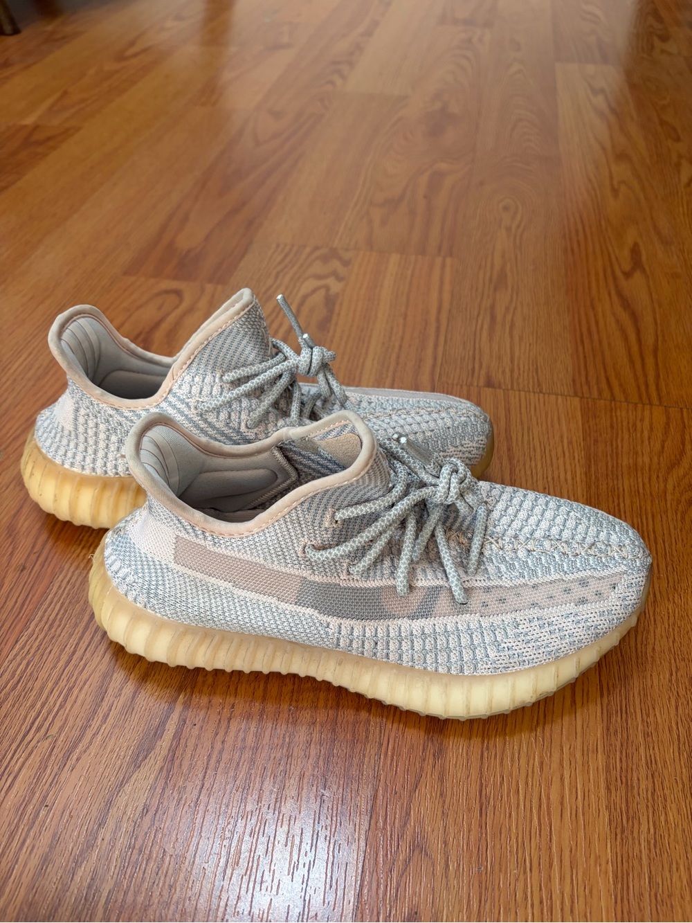 adidas Yeezy knit sneakers in light gray and beige with gum sole